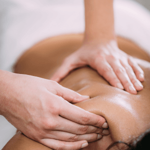 Anthony Thomas performing targeted sports massage on a client's leg at Deanna Thomas Acupuncture and Wellbeing, Middlesbrough